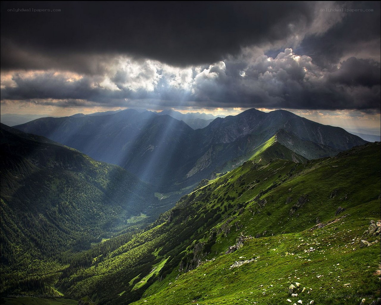 Mountain landscape with sunbeams