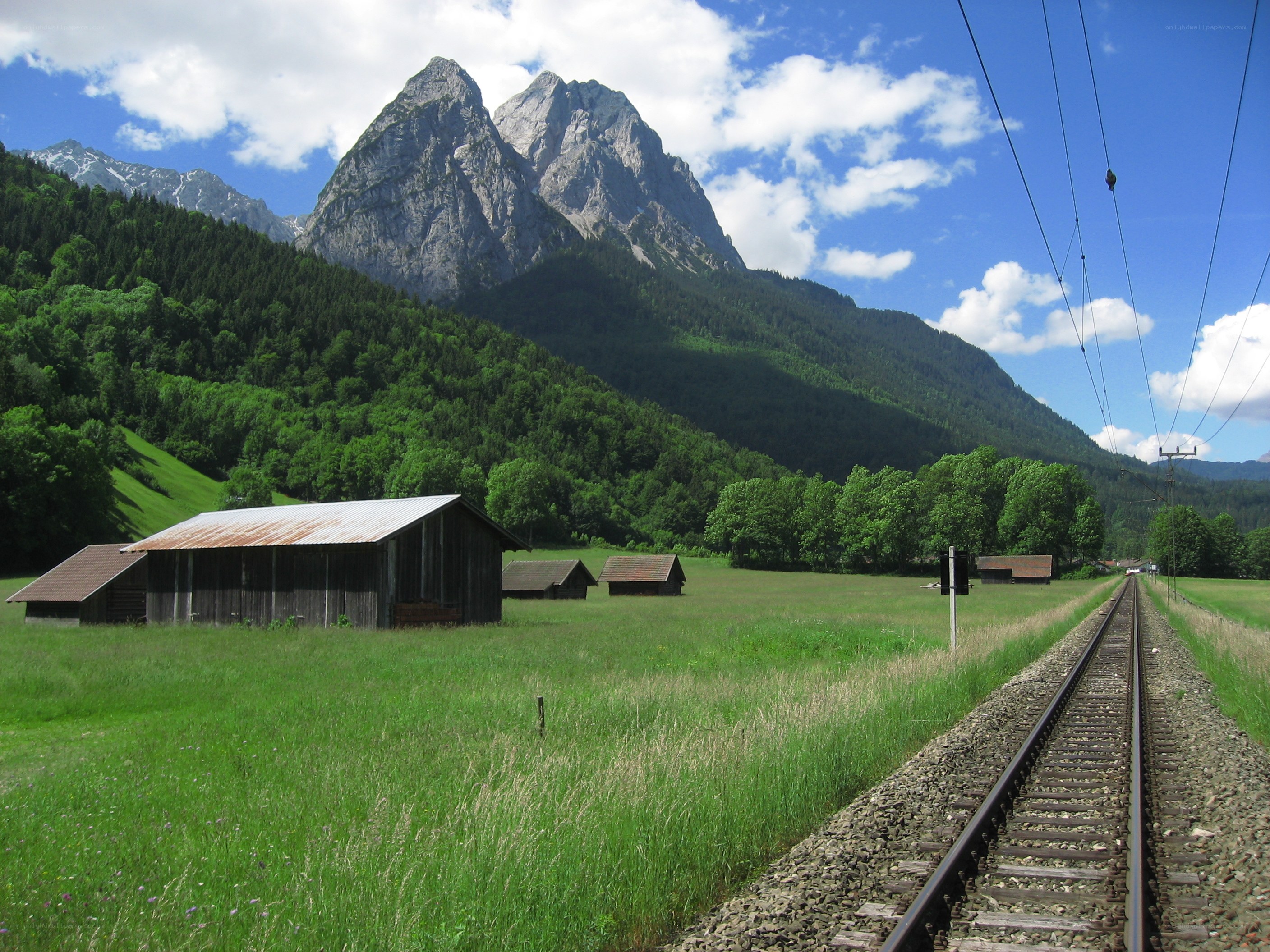 Mountain landscape with train tracks