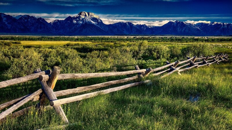 Mountain landscape with wooden fence