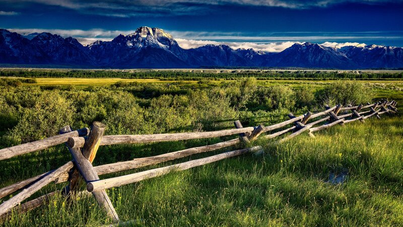 Mountain landscape with wooden fence