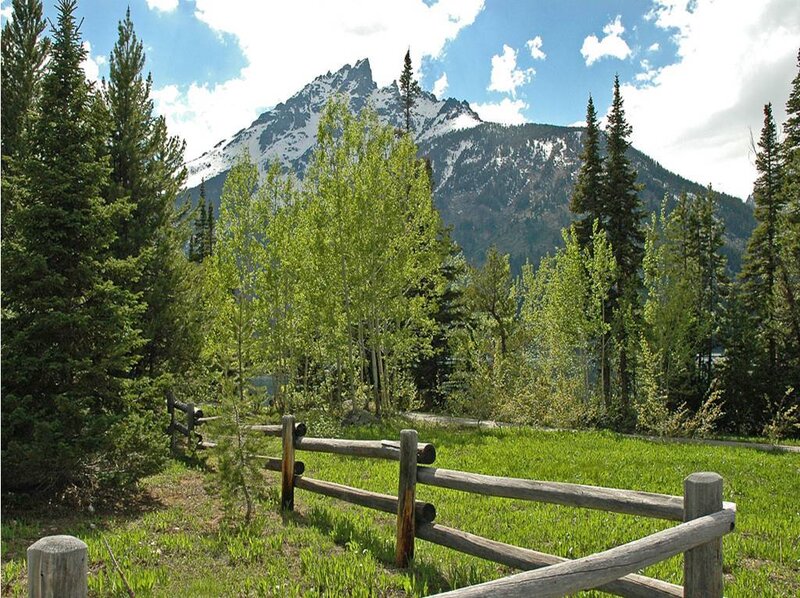 Mountain landscape with wooden fence