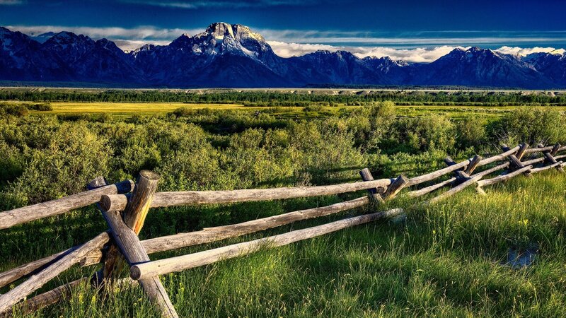 Mountain landscape with wooden fence