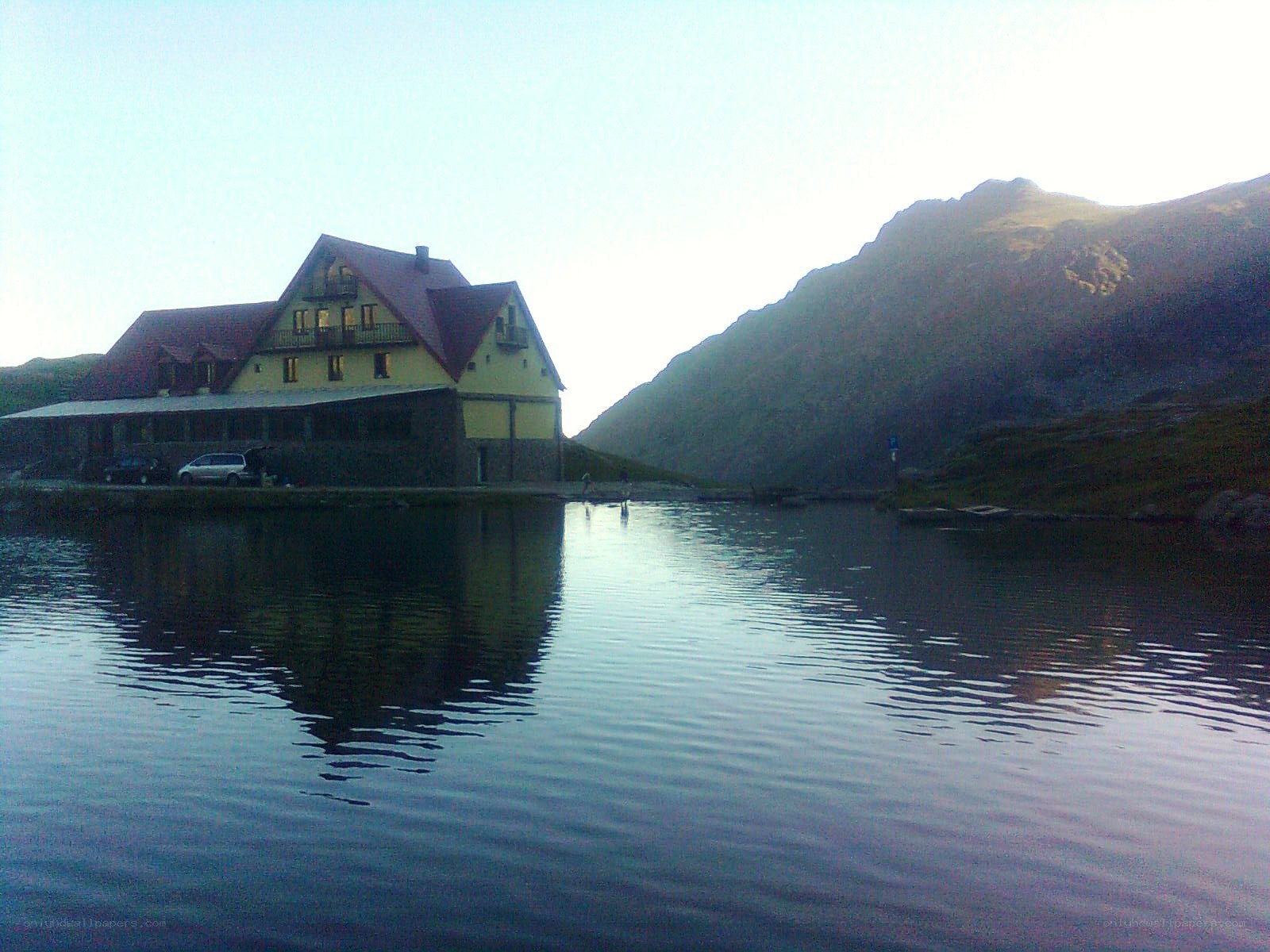 Mountain lodge by a lake