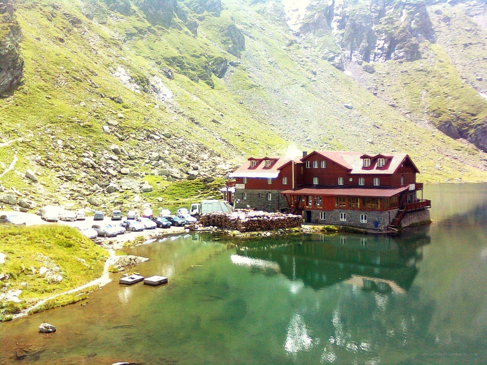 Mountain lodge by a lake