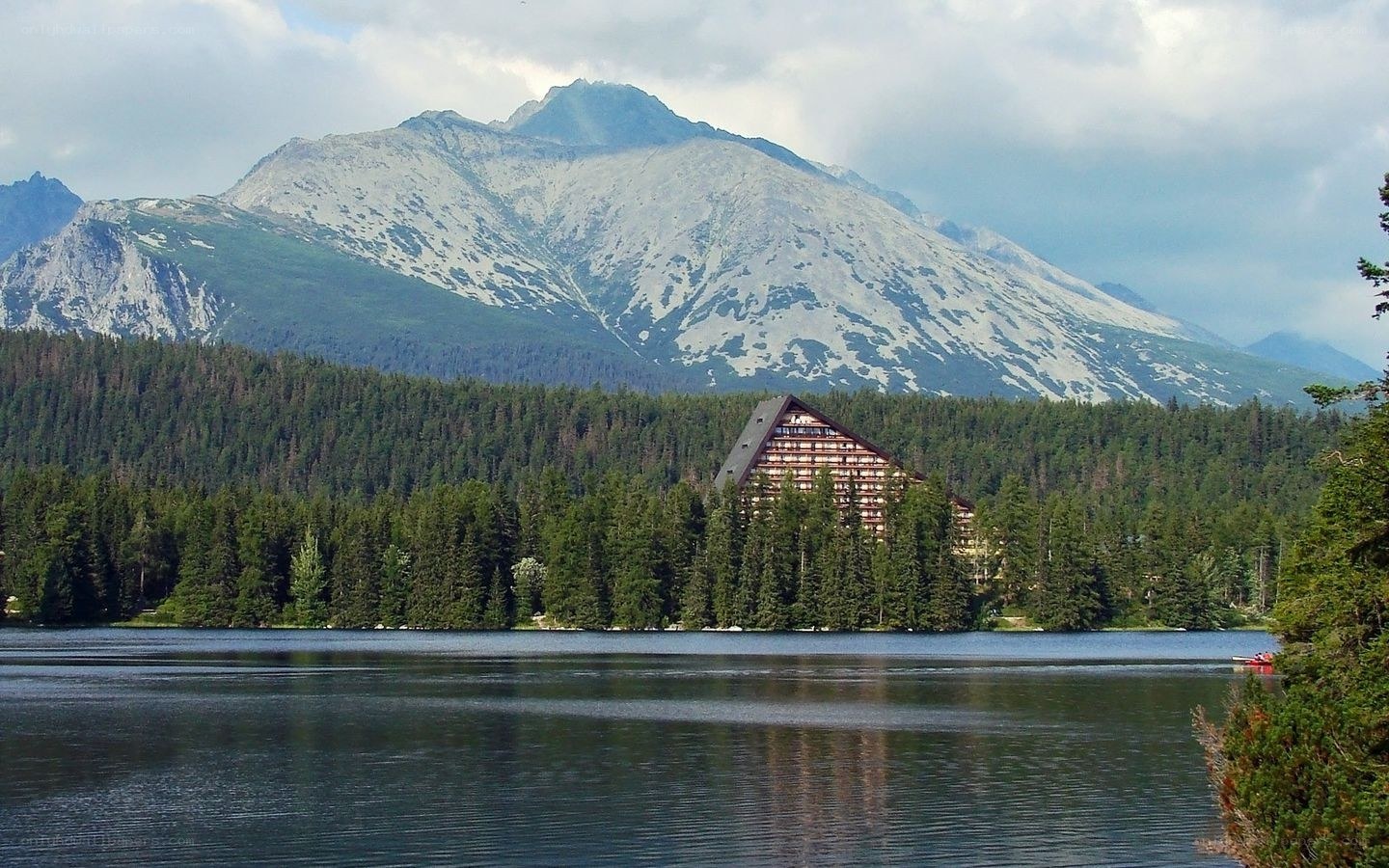 Mountain lodge by a lake