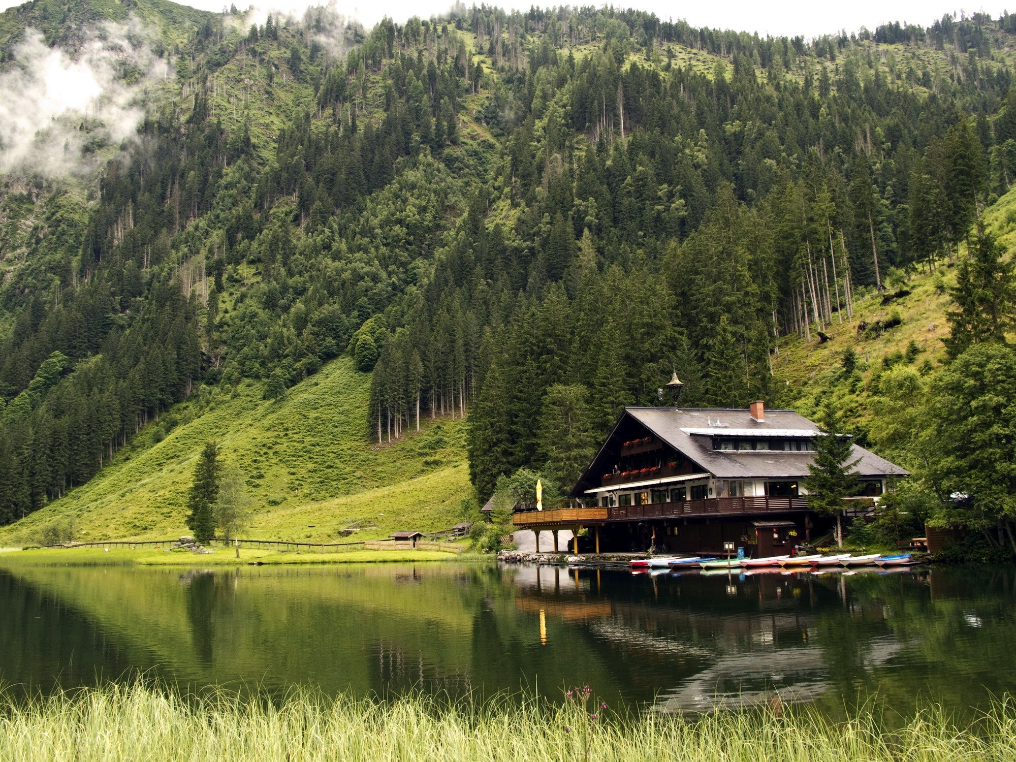 Mountain lodge by a lake