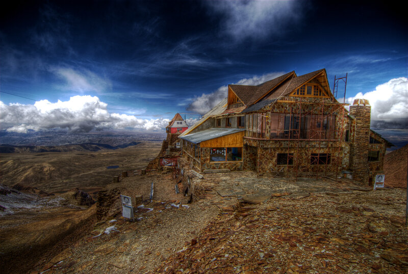Mountain lodge under dramatic sky