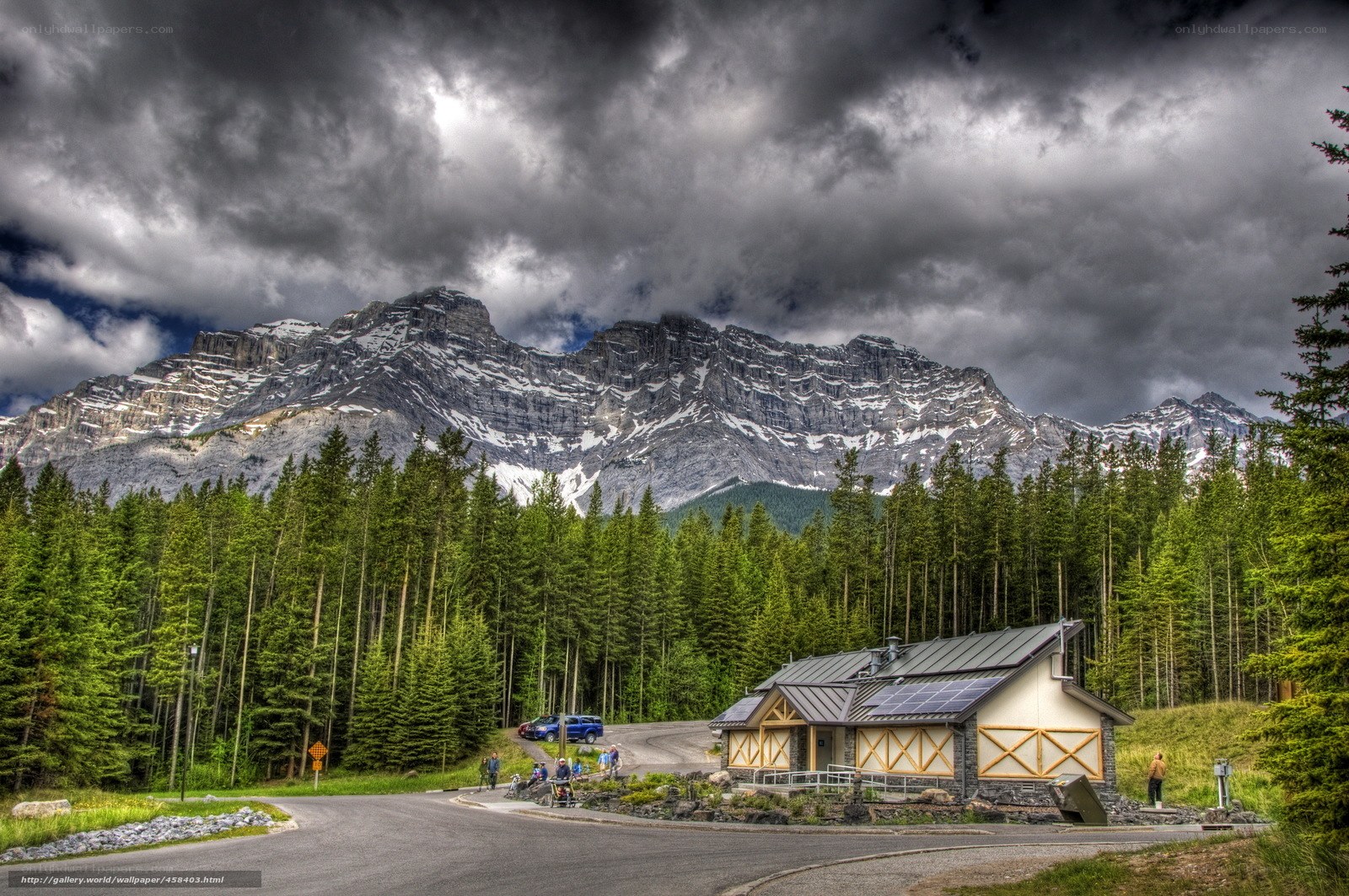 Mountain lodge under stormy sky