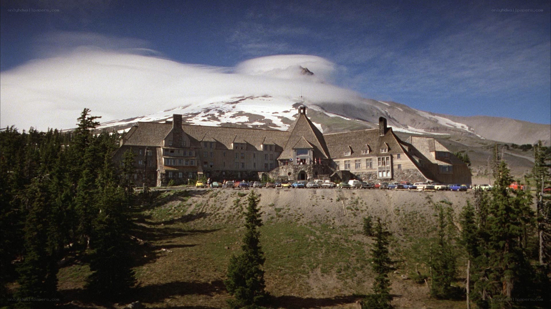 Mountain lodge with snow-capped peak