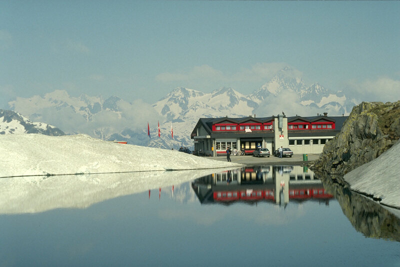 Mountain lodge with snow-capped peaks
