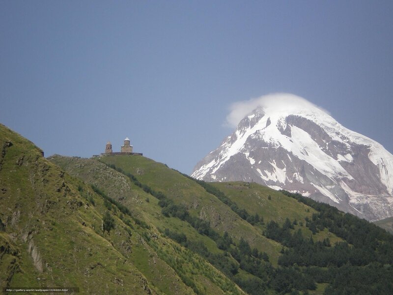 Mountain monastery with snow-capped peak