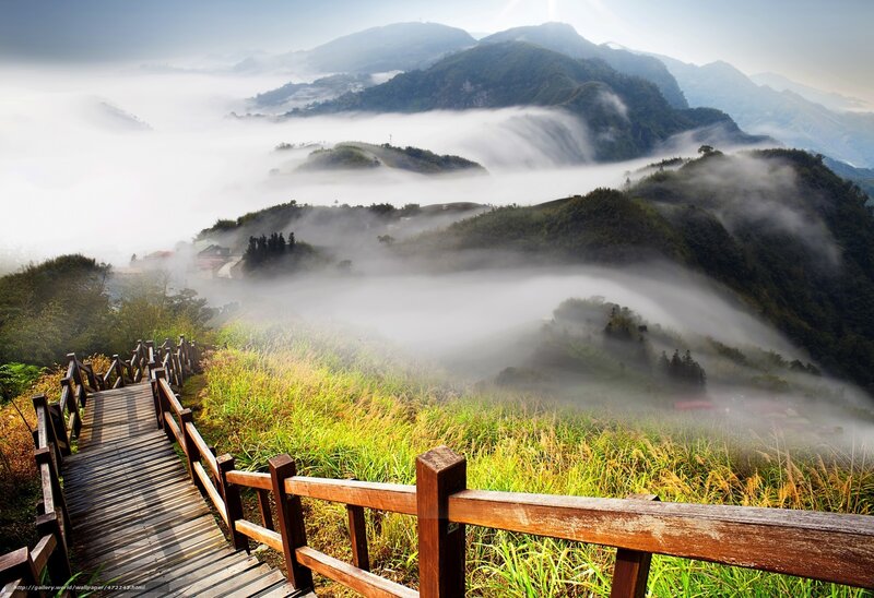 Mountain path through misty hills