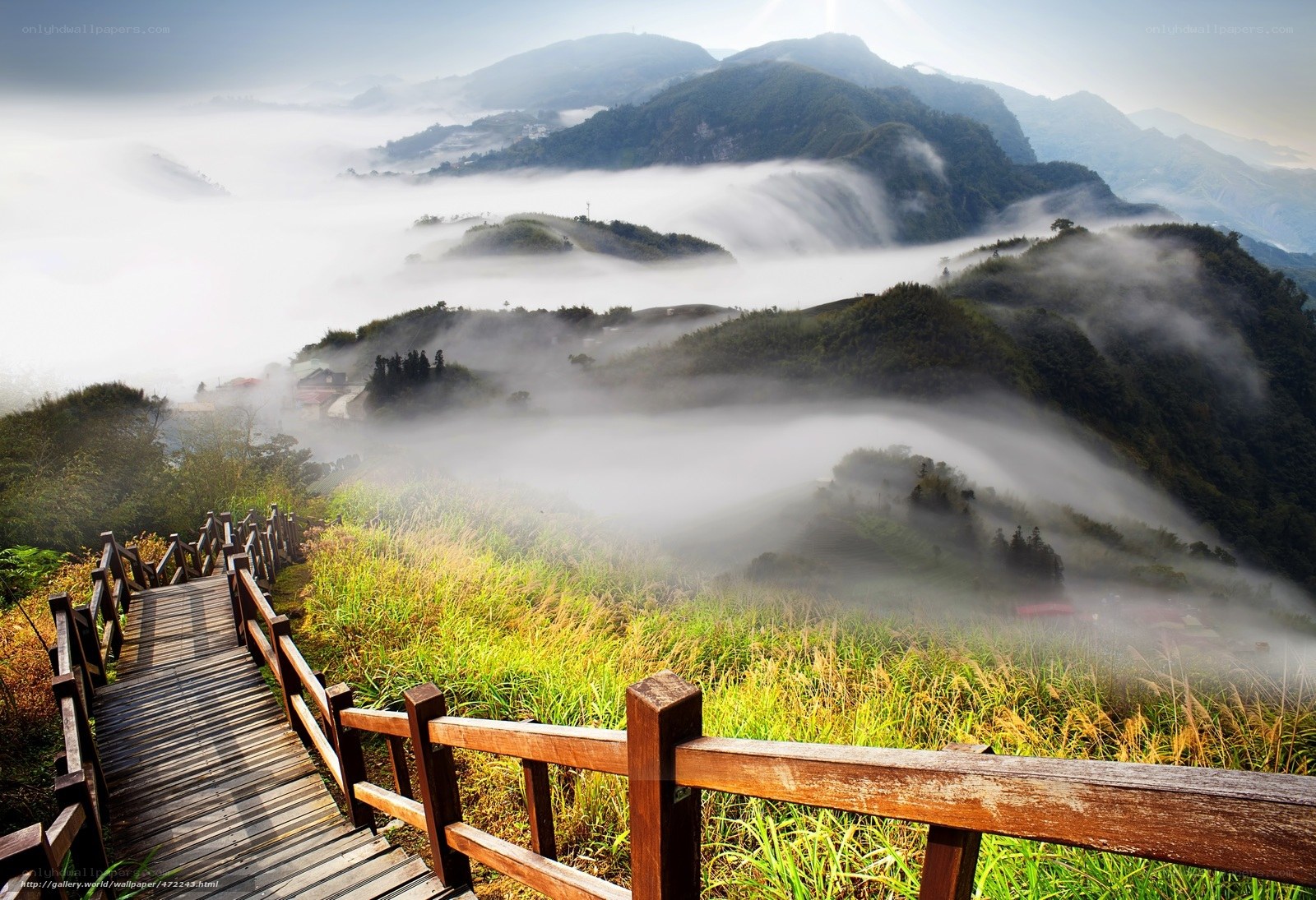 Mountain path through misty hills