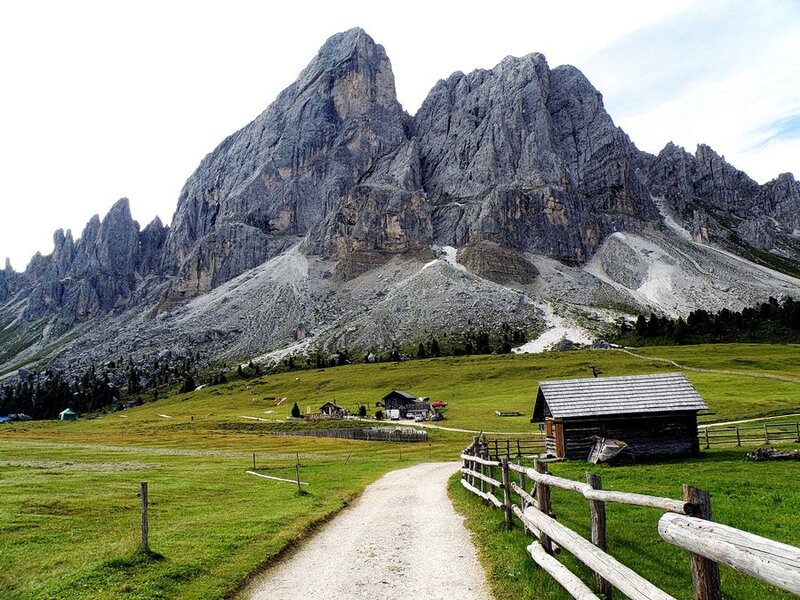 Mountain path with alpine huts