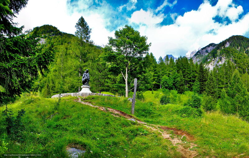 Mountain path with statue