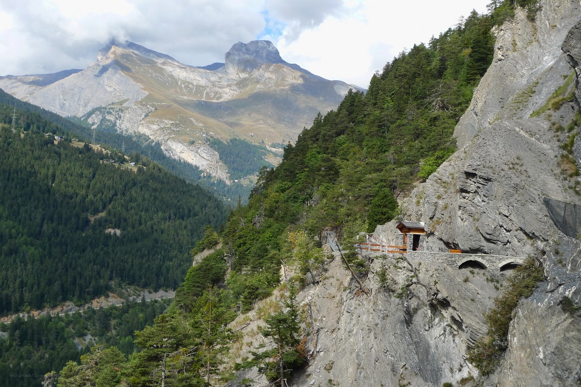 Mountain path with tunnel entrance