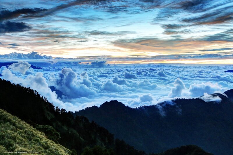 Mountain peak above clouds