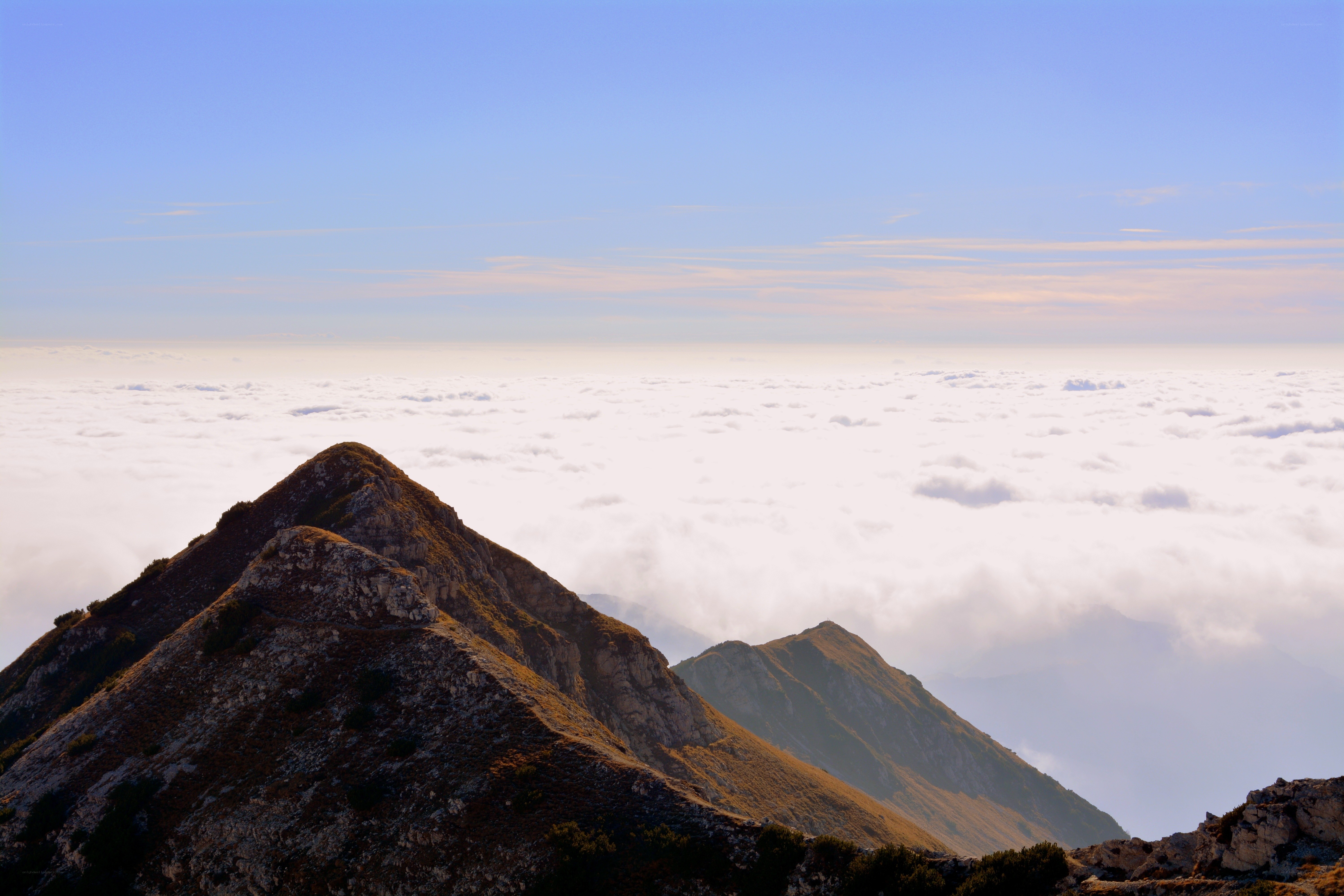 Mountain peak above clouds