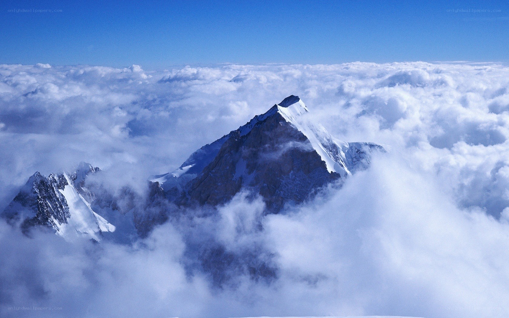 Mountain peak above clouds