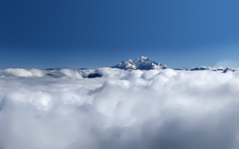 Mountain peak above clouds
