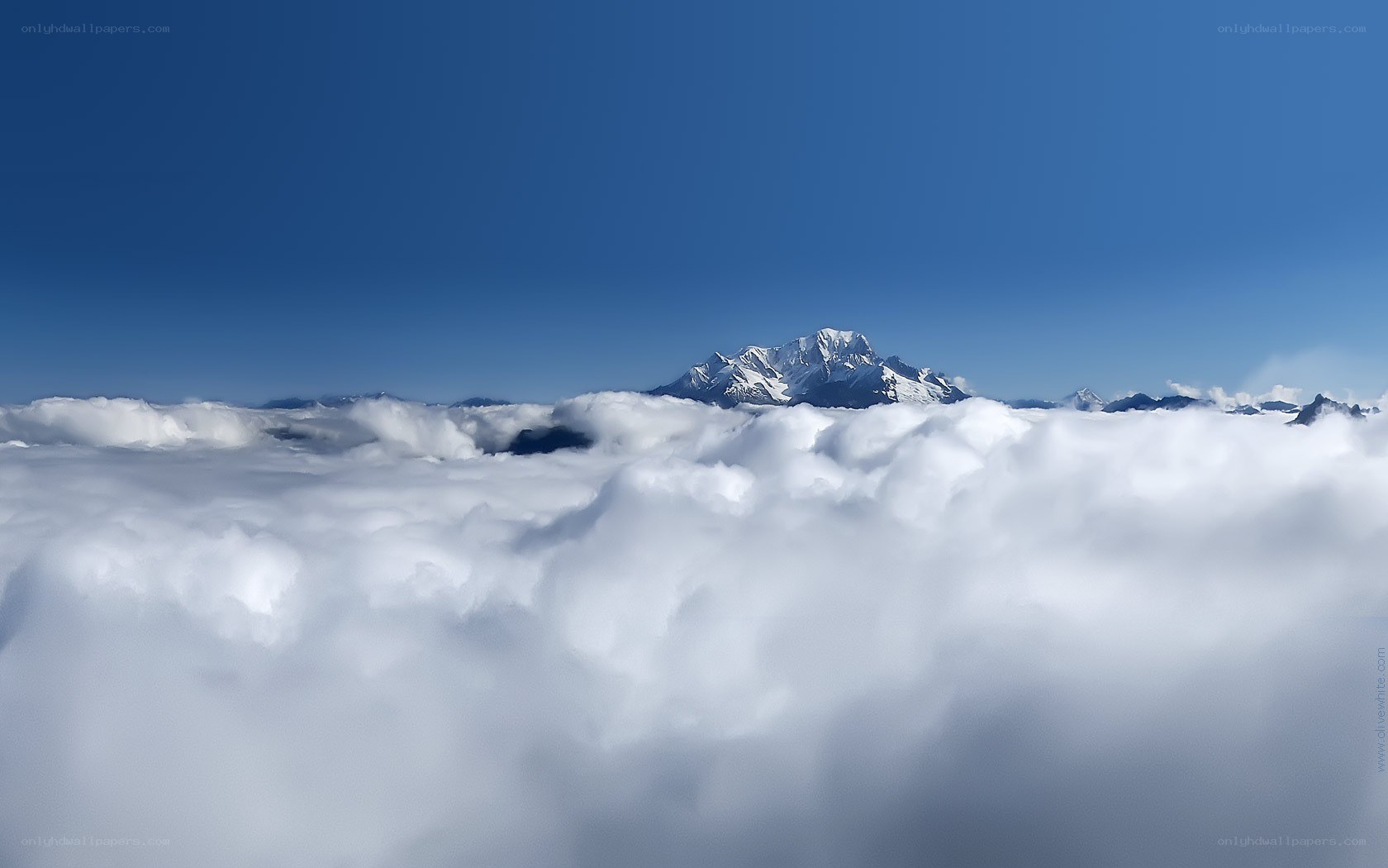 Mountain peak above clouds