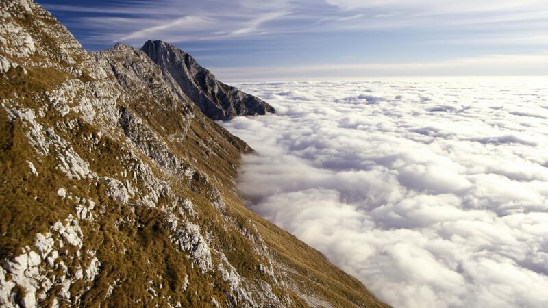 Mountain peak above clouds