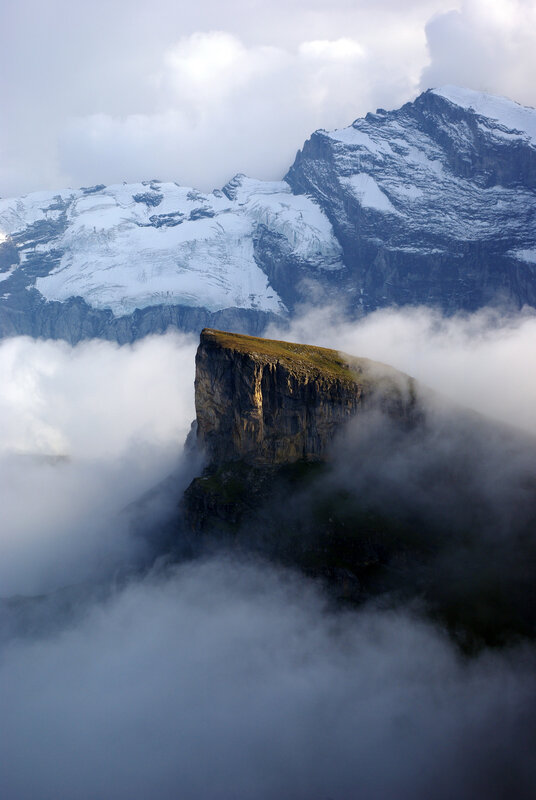 Mountain peak above clouds