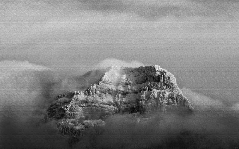 Mountain peak above clouds
