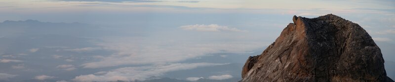 Mountain peak above clouds