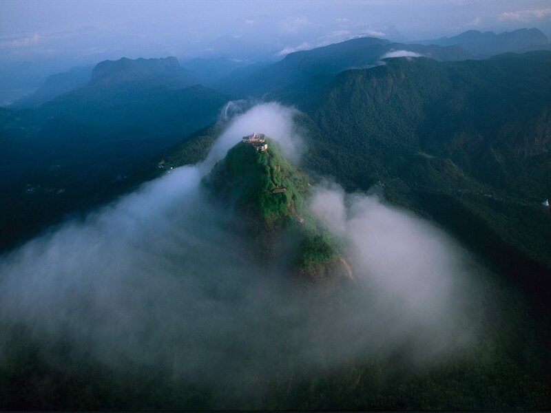 Mountain peak above clouds