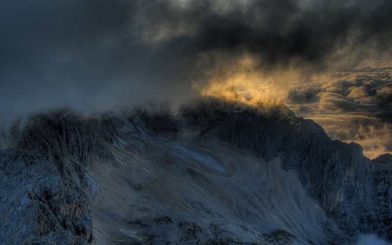Mountain peak above clouds
