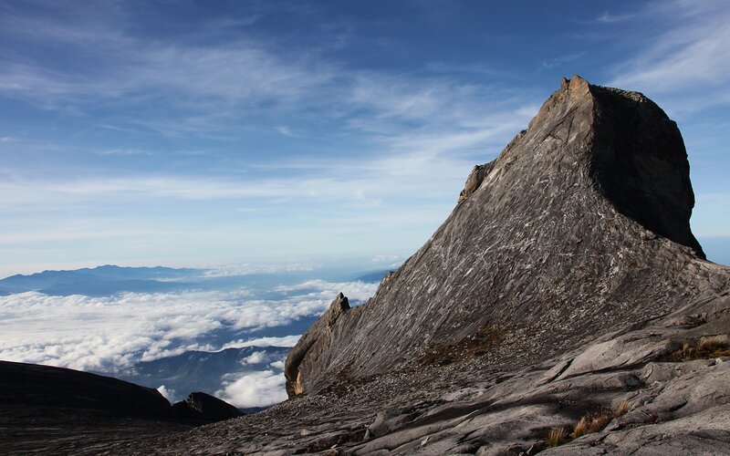 Mountain peak above clouds