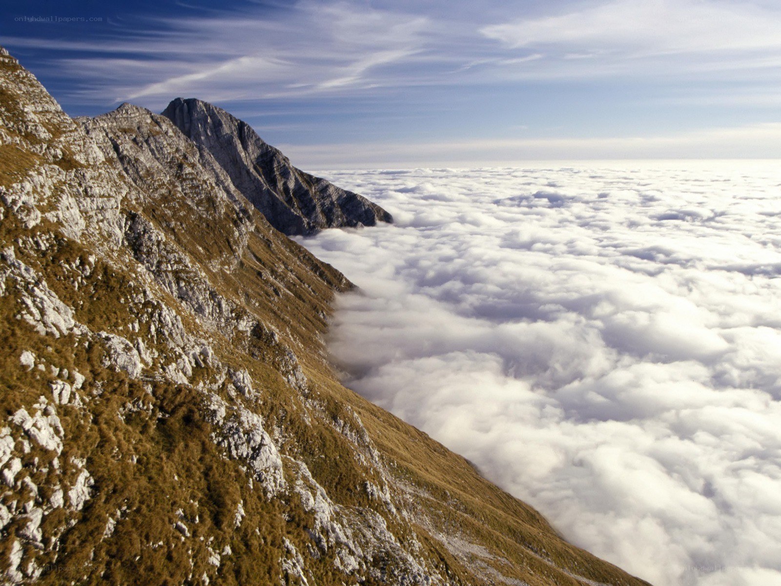 Mountain peak above clouds