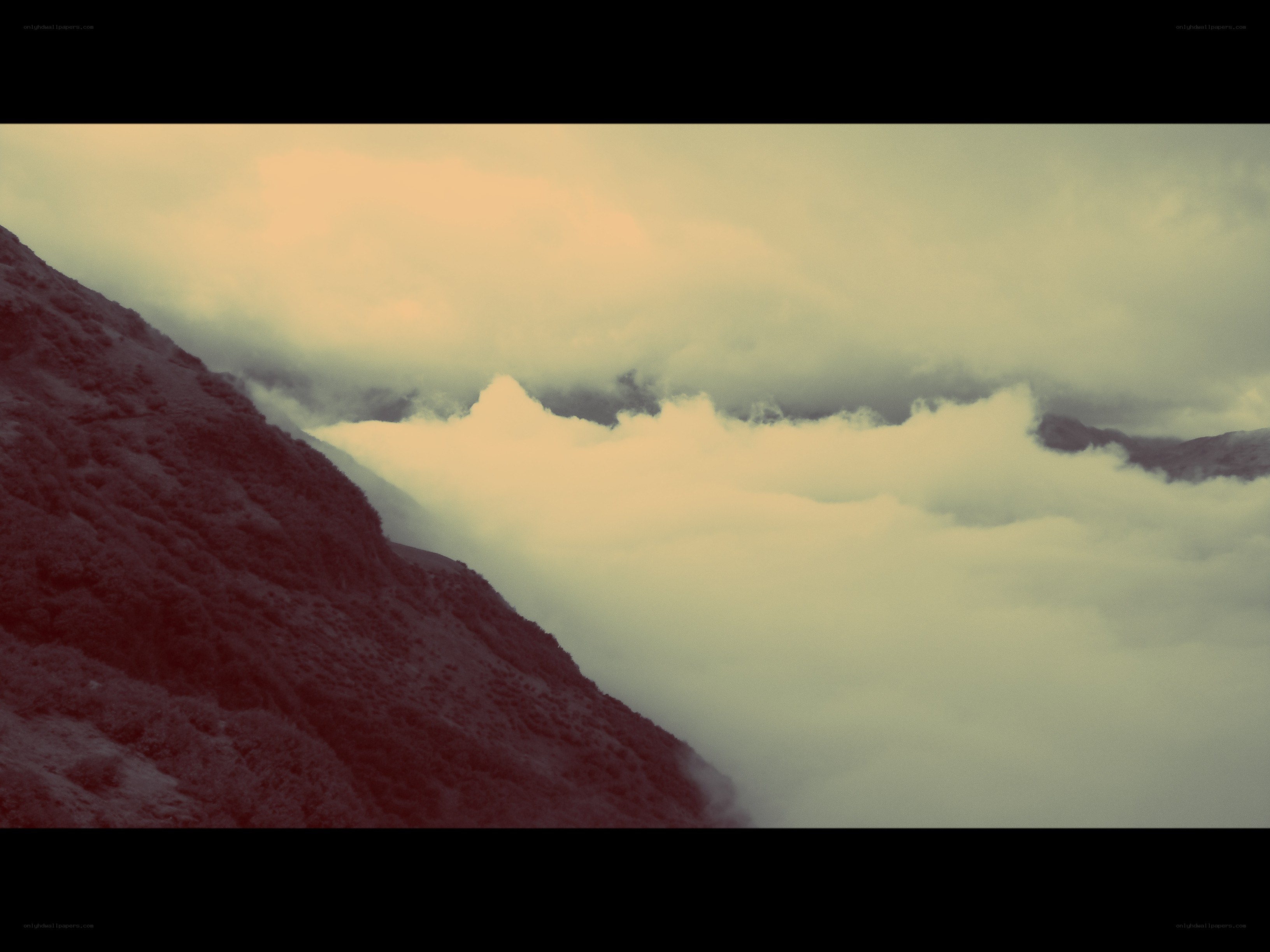 mountain peak above clouds