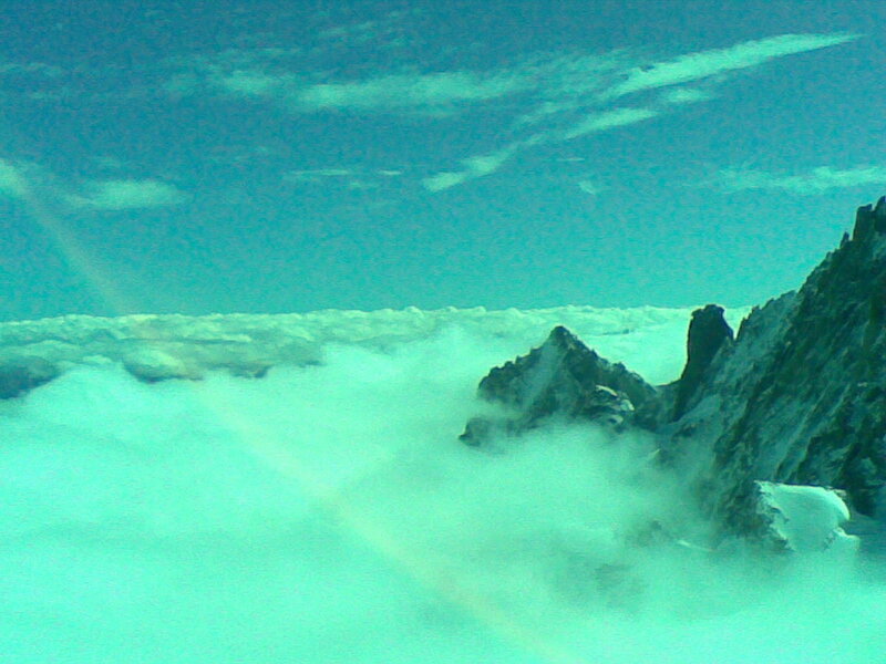 mountain peak above clouds