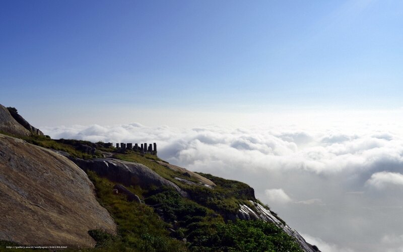 Mountain peak above clouds