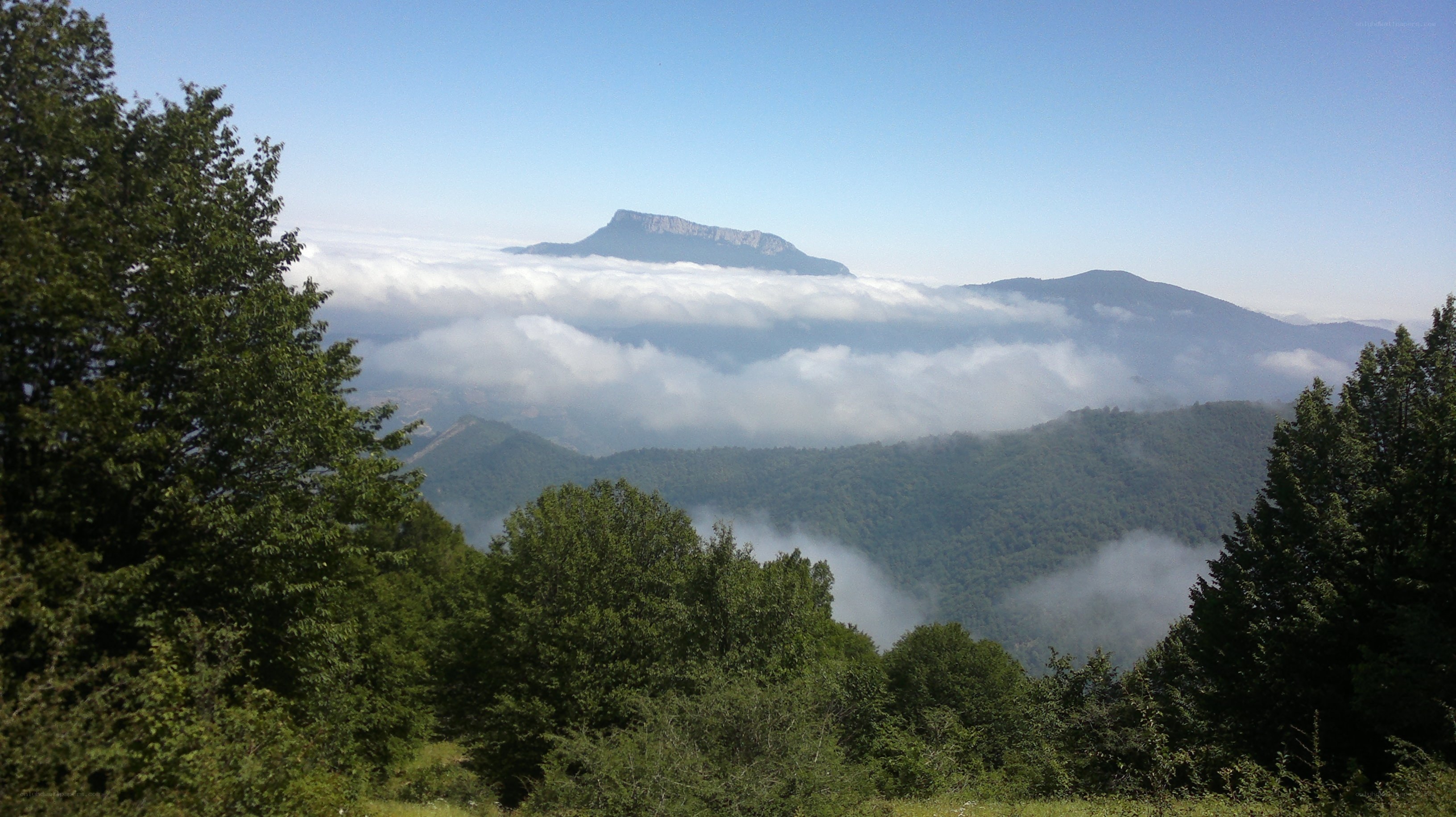 Mountain peak above clouds
