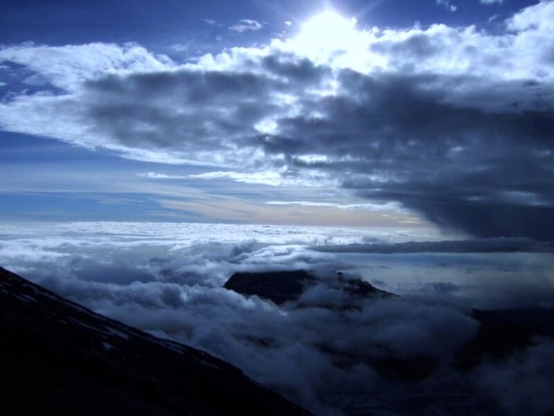 Mountain Peak Above Clouds — Blue, Dramatic, Morning, Photograph, Sun