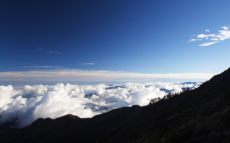 Mountain Peak Above Clouds — Blue, Serene, Morning
