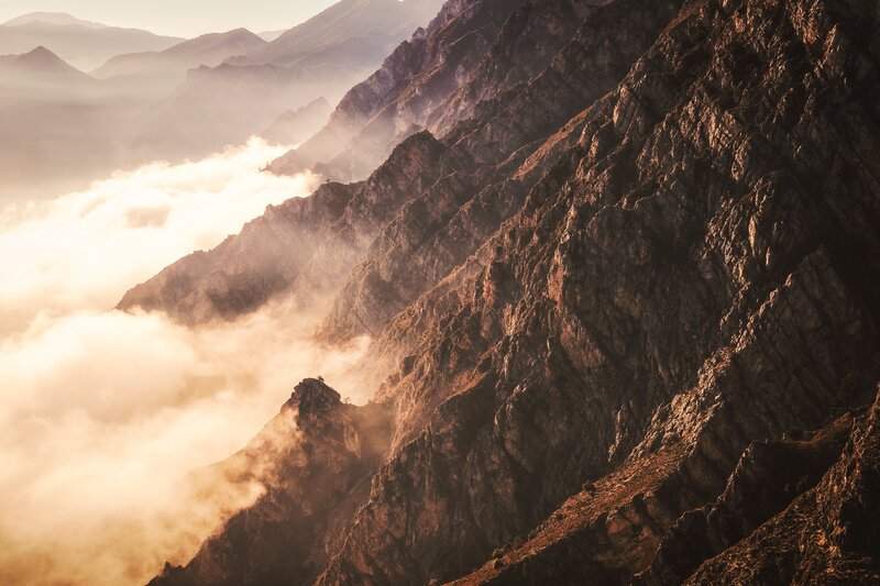 Mountain Peak Above Clouds — Brown