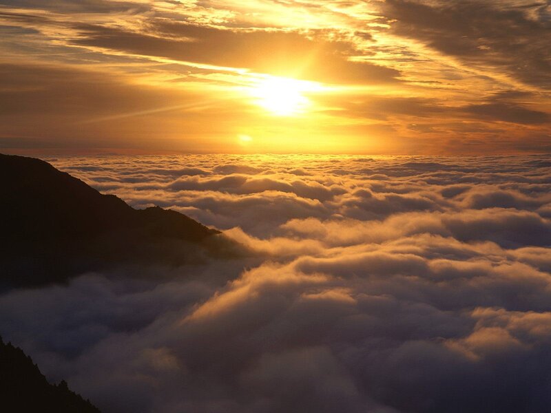 Mountain Peak Above Clouds — Gold, Serene, Sunset