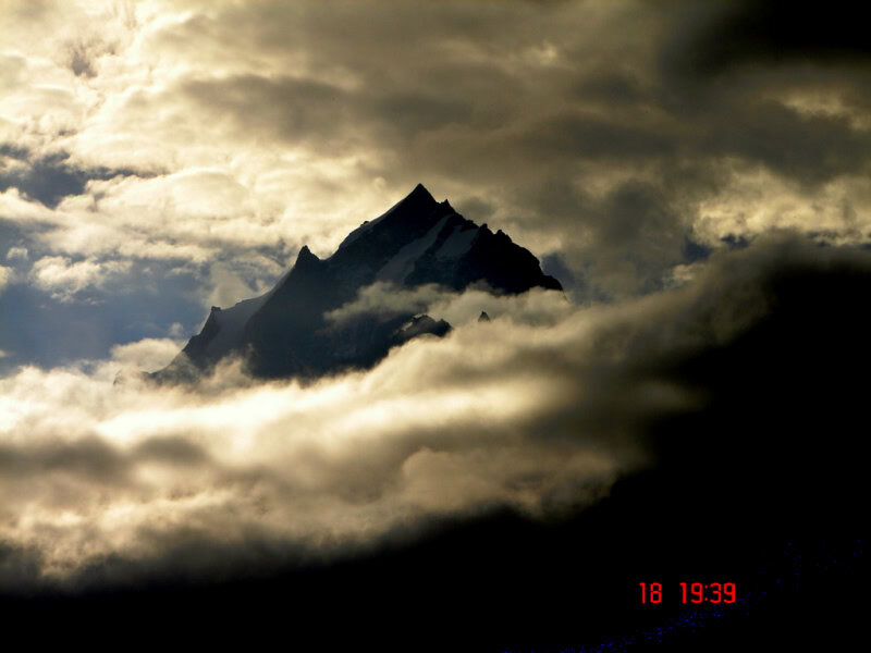 Mountain Peak Above Clouds — Gray, Dramatic