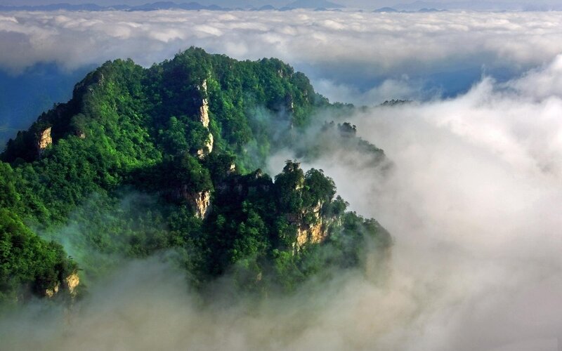 Mountain Peak Above Clouds — Green, Serene, Morning