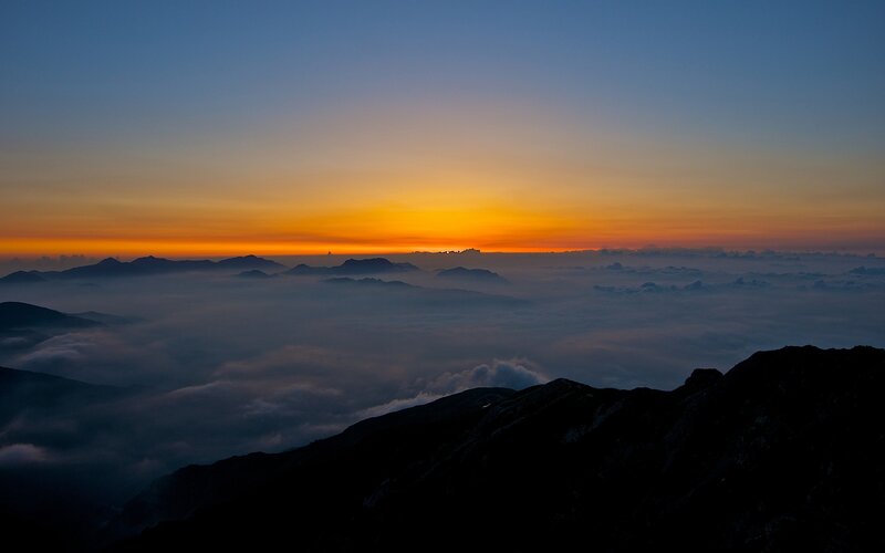 Mountain Peak Above Clouds — Orange, Serene, Sunrise, Photograph, Sky, Mountains, Blue