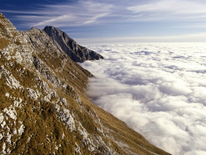 Mountain Peak Above Clouds — White, Serene, Afternoon, Photograph, Sky, Rock, Blue, Brown