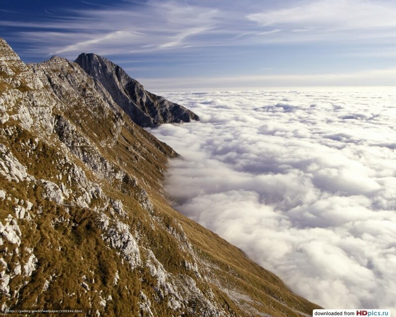 Mountain Peak Above Clouds — White, Serene, Afternoon