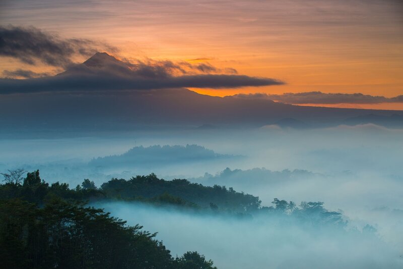 Mountain Peak Above Fog — Orange, Serene