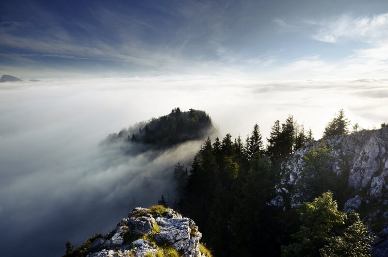 Mountain peak above sea of clouds