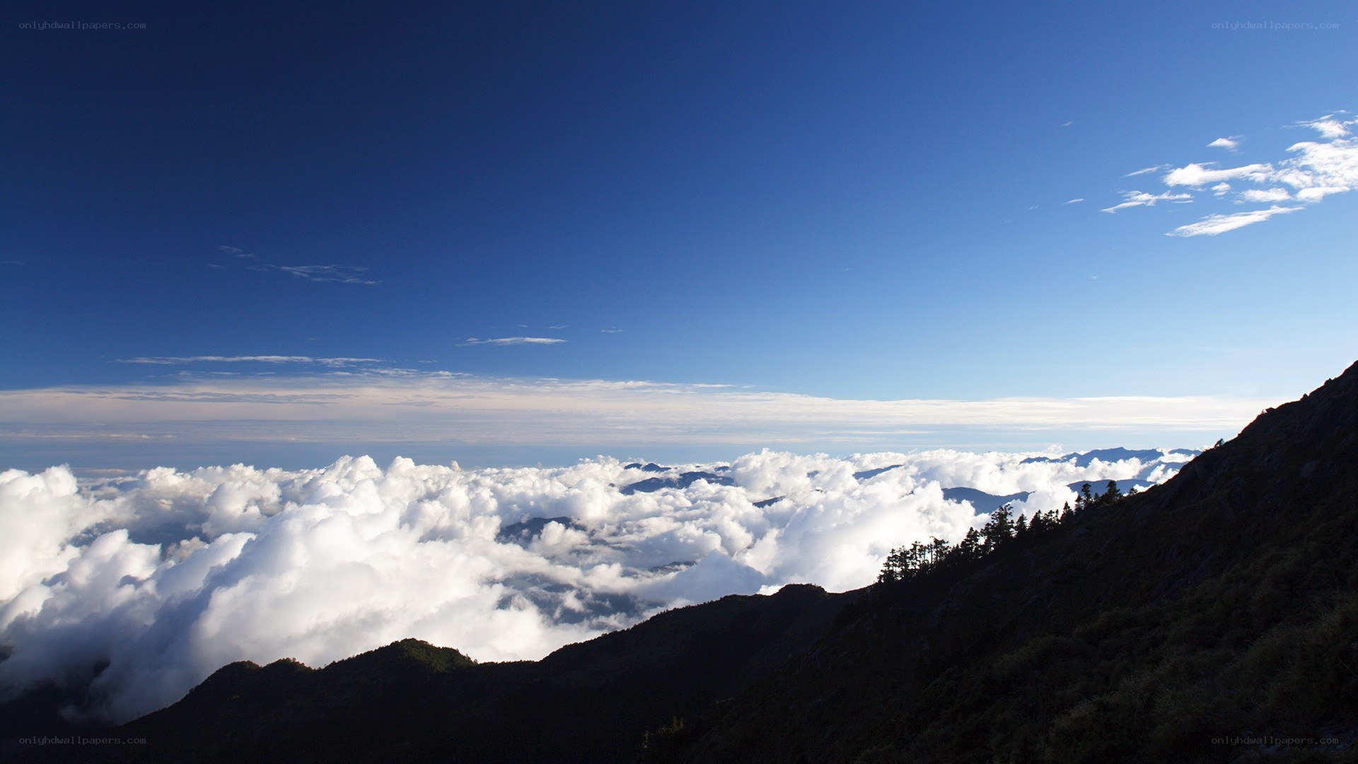 Mountain peak above the clouds