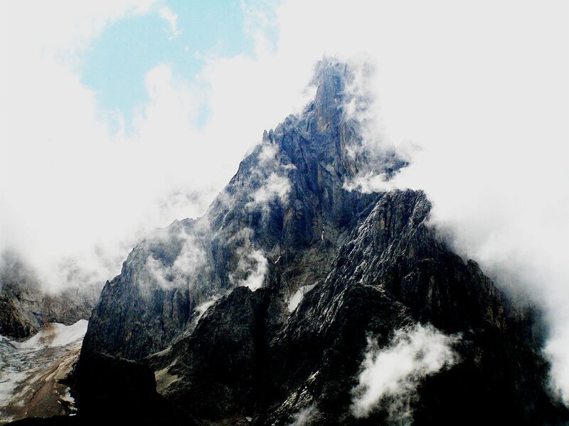 Mountain Peak in Clouds — Gray, Dramatic, Photograph, Rock
